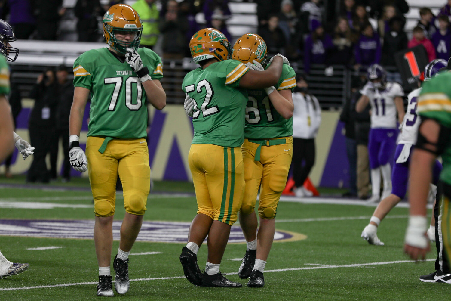 Tumwater players after a 60-30 loss to Anacortes Dec. 2. at Husky Stadium.